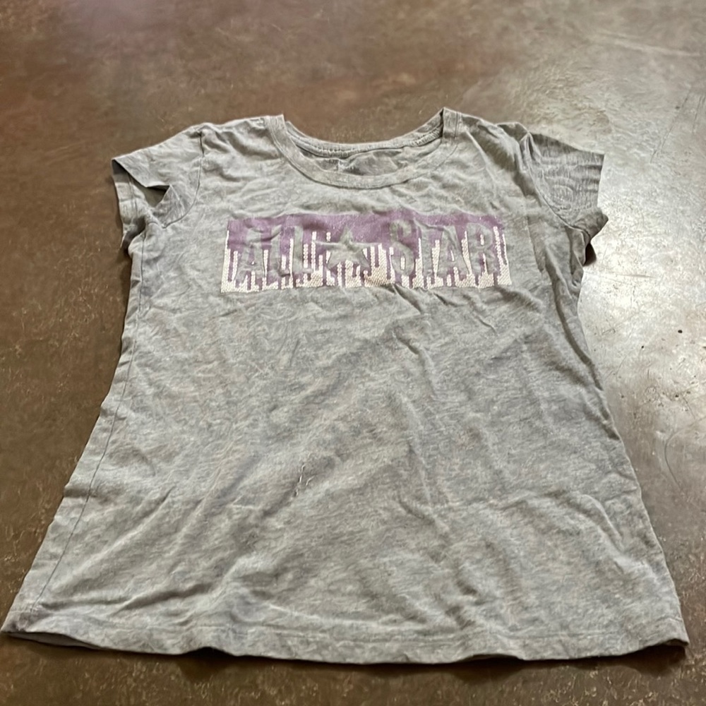 Cute grey shirt, says “All Star”